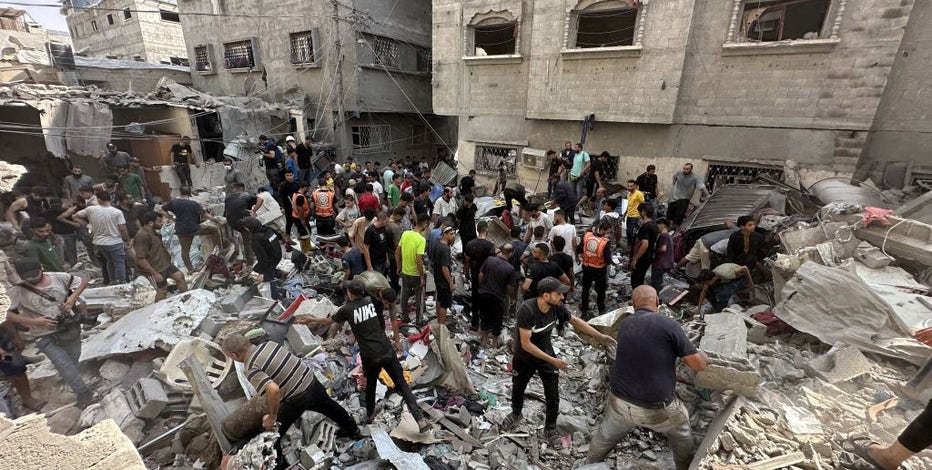 Israel launches 400 strikes across Gaza, where health officials say hundreds of Palestinians killed