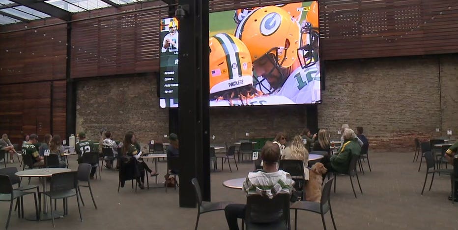 Packers fans, 'happy there's a season,' watch game at 'distanced tables'
