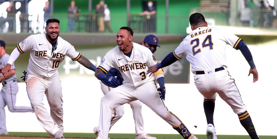 Brewers rally in 9th, win it in 10th to top Twins in home opener