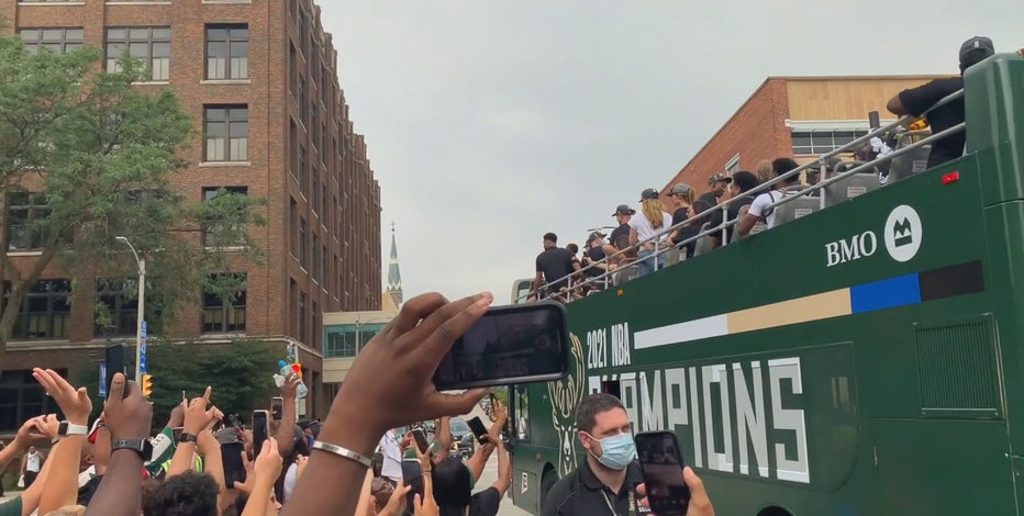 Before championship parade, Bucks fans try to get sneak peek at team