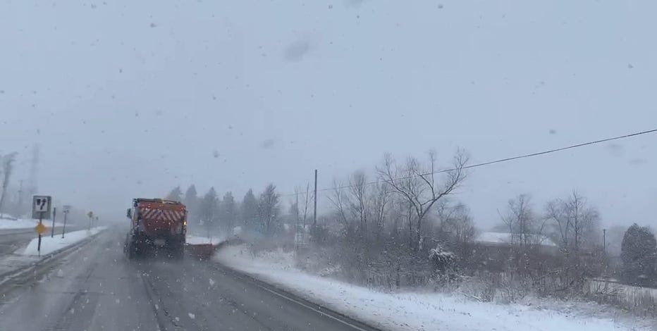 Snow moving through SE Wisconsin, roads snow covered