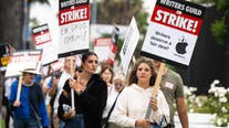 Hollywood writers union leaders end strike as board members approve contract with studios