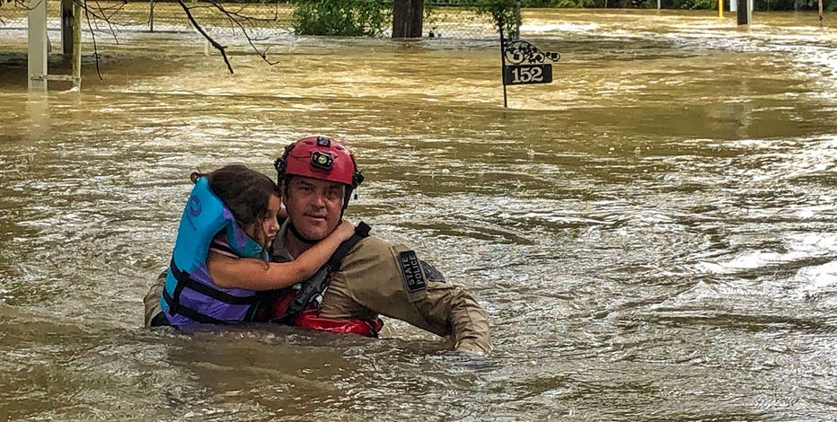 Texas Game Wardens and neighbors rescue families hit by Tropical Depression Imelda in Conroe