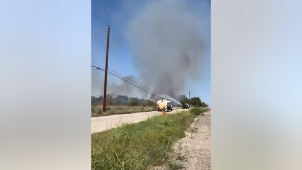 Buda brush fire: Several roads closed as crews work to put out fire