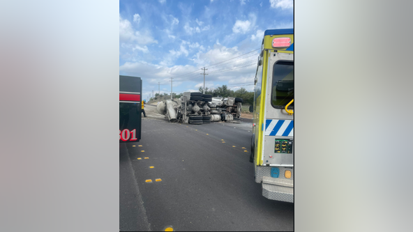Driver trapped, all lanes shut down on SH 71 after cement truck overturned