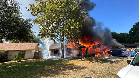 Firefighters battling house fire in South Austin; second structure now involved