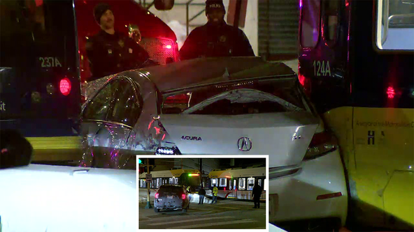 2 hurt as car ends up wedged between 2 light rail trains in Minneapolis