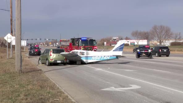 Small plane lands on road, strikes car in Brooklyn Park