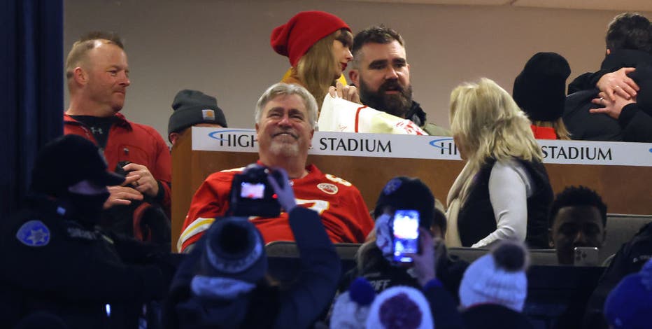 Jason Kelce and Taylor Swift pictured together as they cheer on Travis at Chiefs playoff game