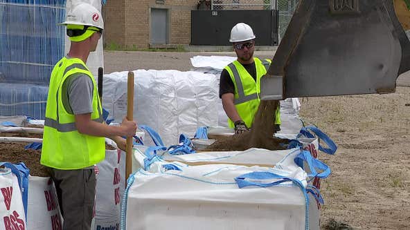 Sandbagging to protect Black Dog Power Station from Minnesota River flooding