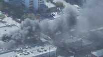 Crews extinguish fire at commercial building in Chinatown