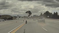 WATCH: Tire pops off truck, causes car to flip on Chatsworth freeway