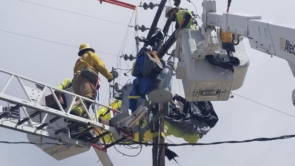 PHOTOS: Skydiver becomes stuck in power lines in Riverside County