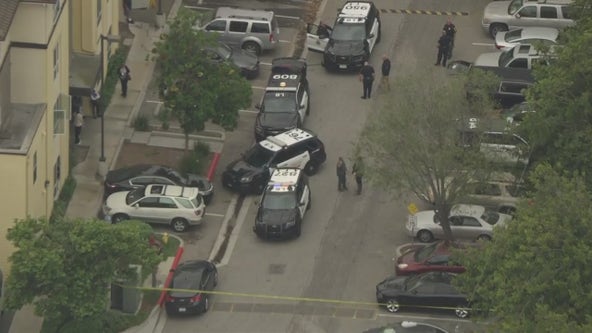 Shooting suspect barricaded inside Long Beach building