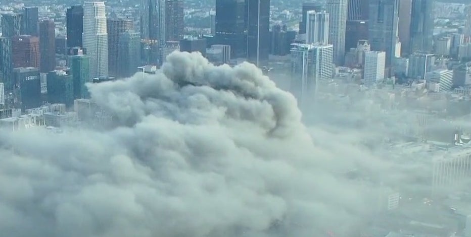 Plume of smoke seen for miles after massive fire erupts in downtown Los Angeles