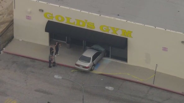 Suspect allegedly in stolen car crashes into Gold's Gym