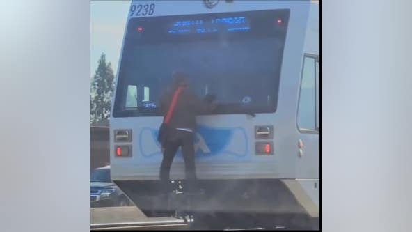 Person seen dangerously clinging to VTA light rail as it speeds along track