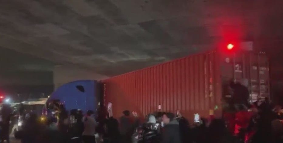 Oakland sideshow video: Semi-truck spins as crowd cheers, climbs trailer