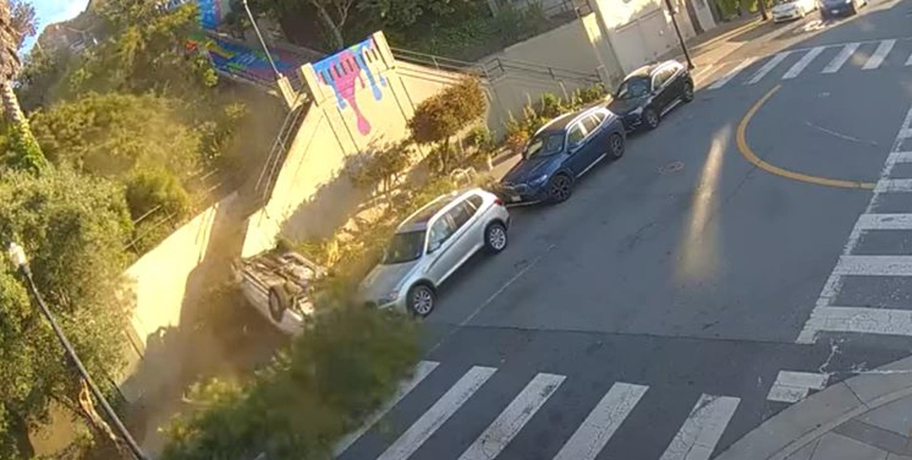 Video: Car lands upside down after crashing through San Francisco barrier