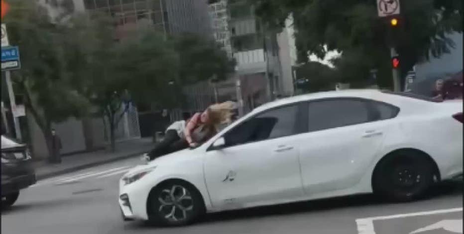 Video: Woman jumps onto moving car, after thieves steal her dog