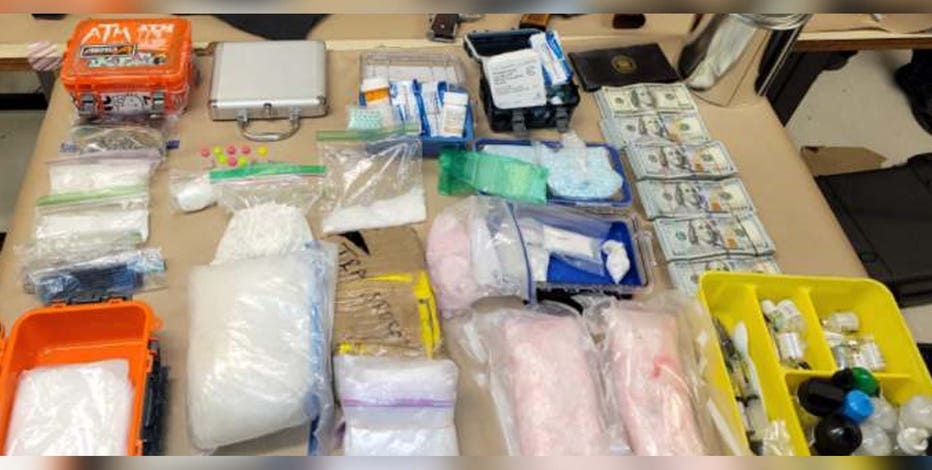 Seattle Police arrest drug trafficking suspect, seize guns and pounds of drugs