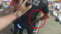 VIDEO: Armed robbery suspect tries to steal SPD officer's gun during arrest