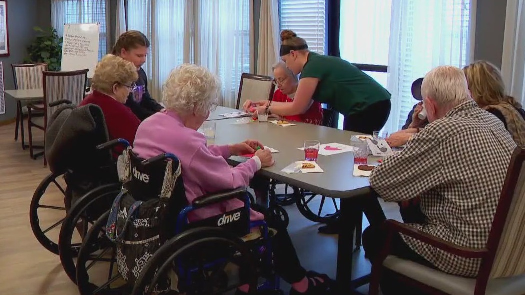 Young senior center volunteer brings residents joy