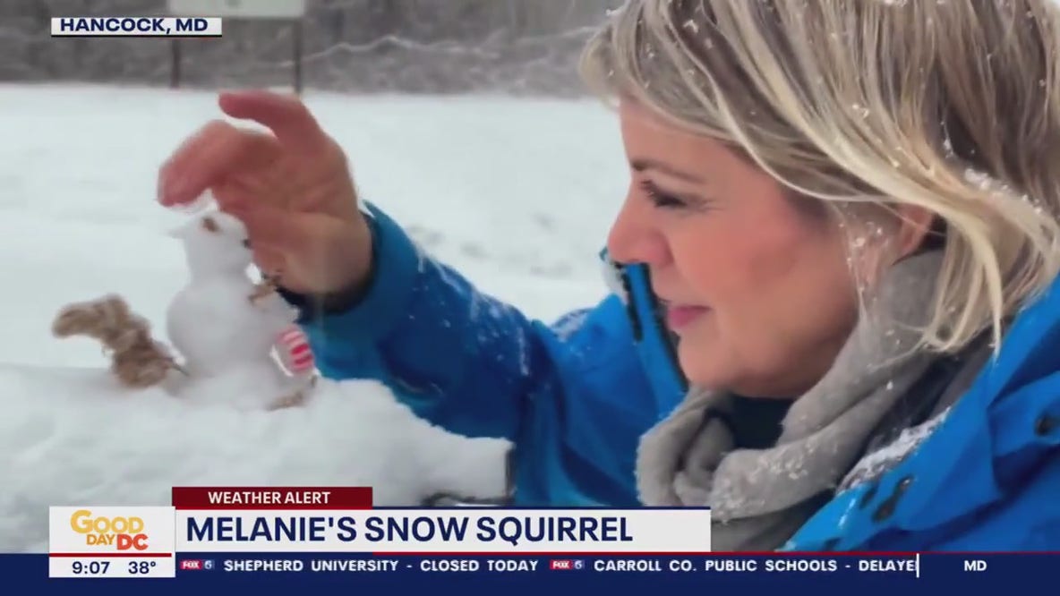 Making a tiny snowman as snow falls in western Maryland