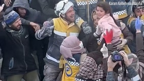Crowd cheers as Syrian children pulled from rubble