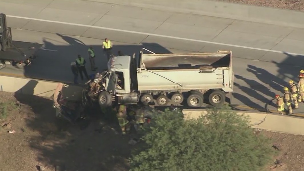 Semi crashes into freeway wall in Phoenix