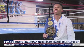Young boxer making history, lifting people up