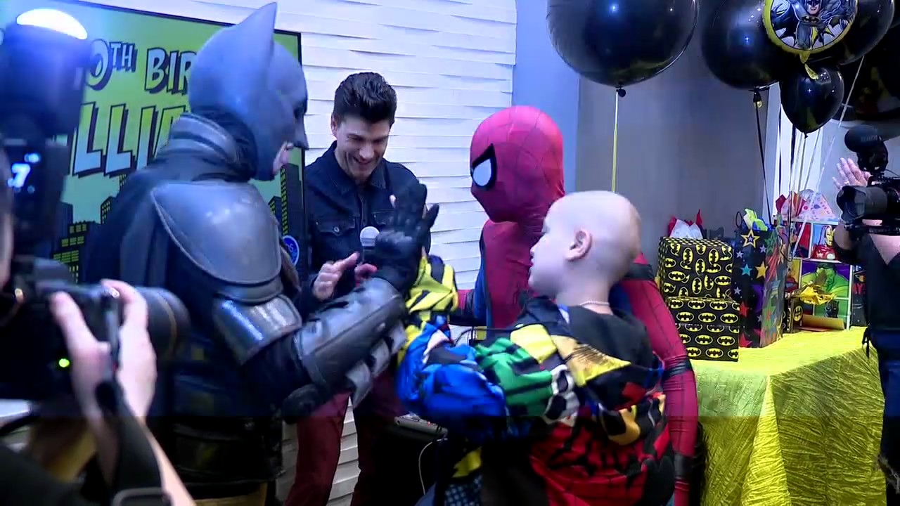 Child cancer survivor surprised by superheroes for 10th birthday