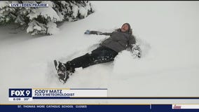 FOX 9's Cody Matz makes snow angel
