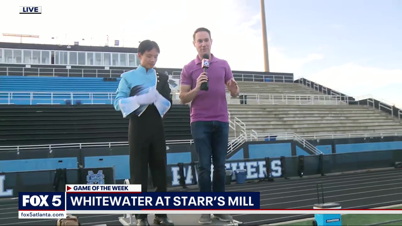 FOX 5's Justin Felder tries out to drum major of Starr's Mill Marching Band