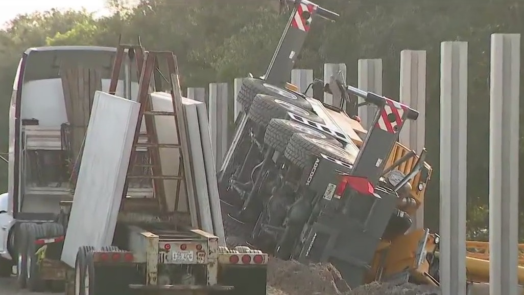 Crane topples over person at work site