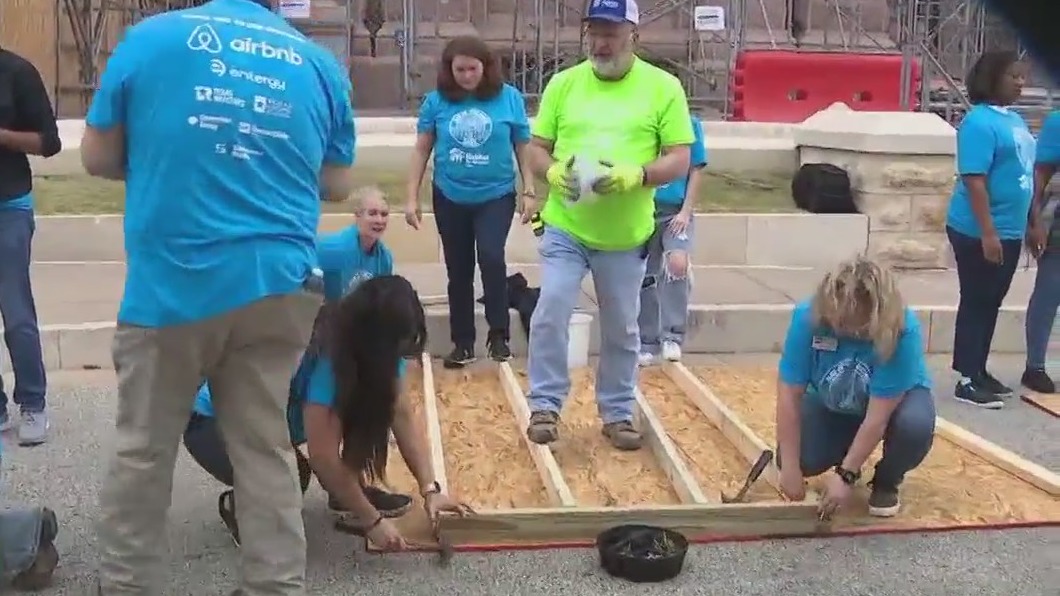 State legislators and volunteers build a home for Texas family in need