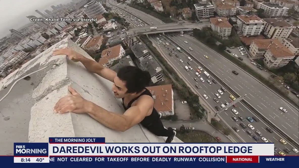 Parkour daredevil does pullups off edge of Istanbul building
