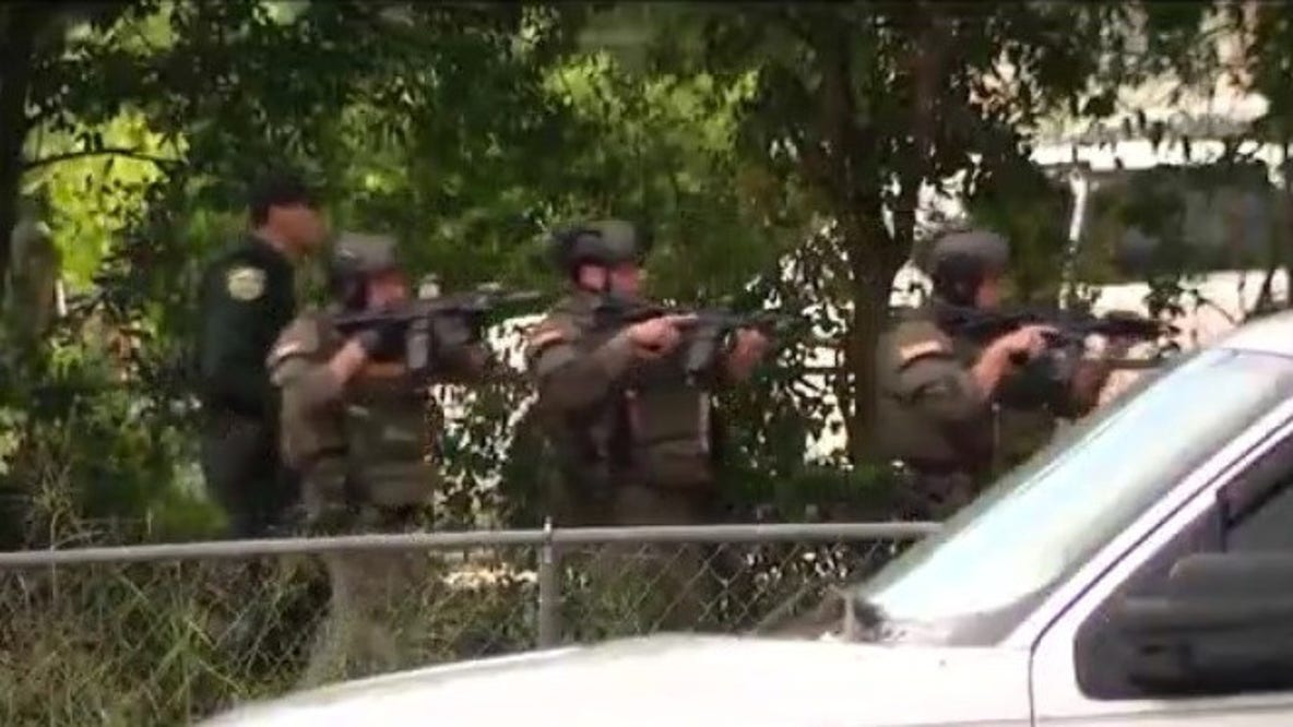 Heavy law enforcement presence outside Pine Hills home after woman was held against her will, deputies say