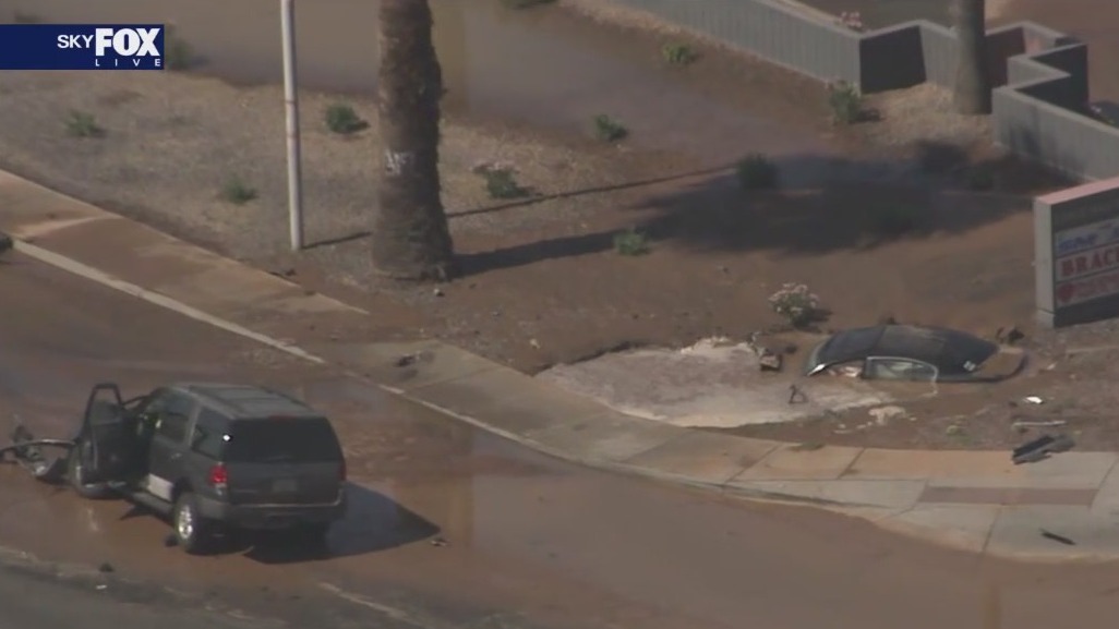 Car sinks into mud near Desert Sky Mall