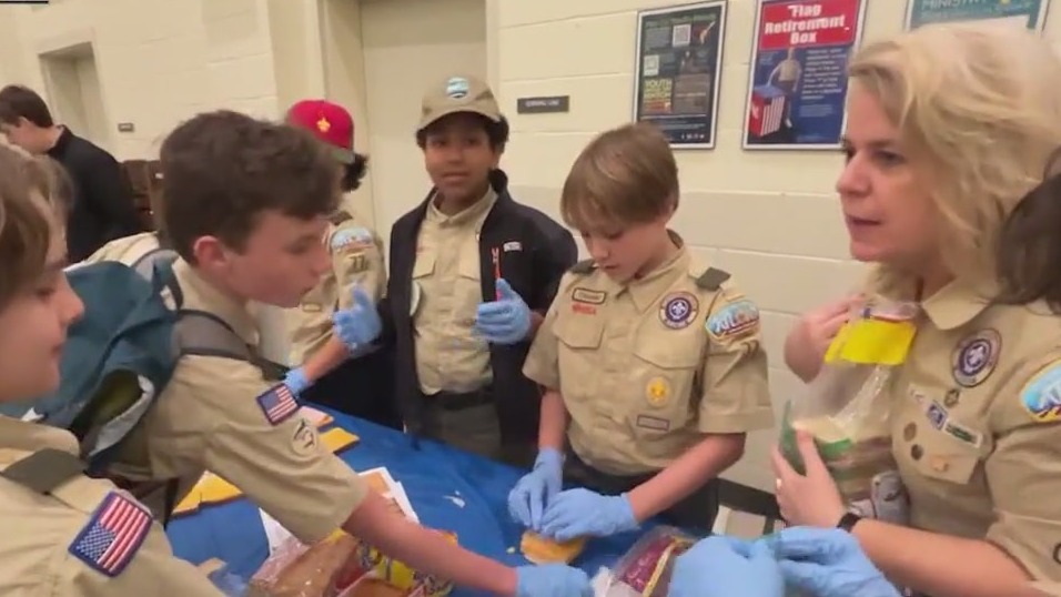 Scouts make sandwiches for hungry
