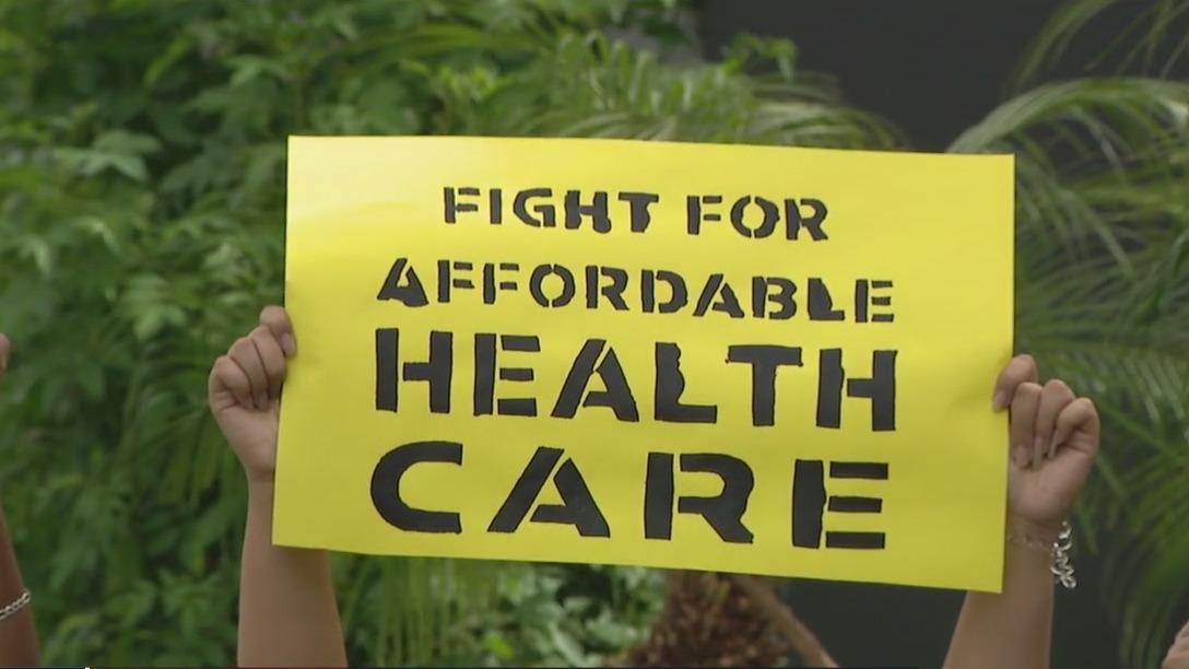 Groups protest outside Sen. Sinema's office