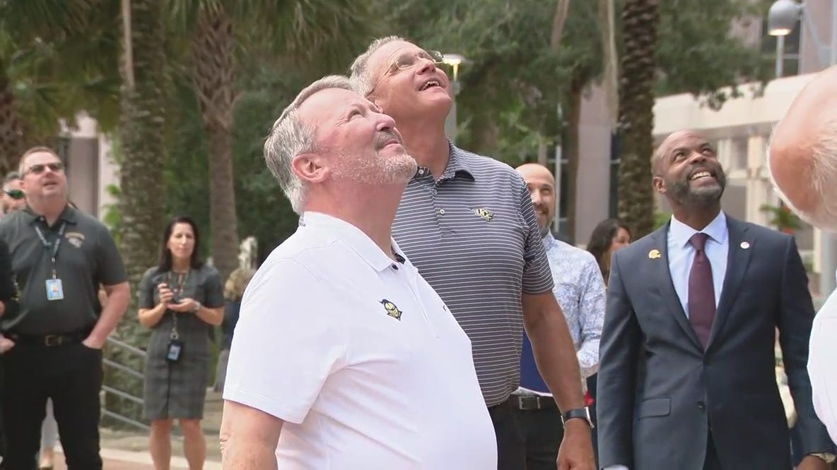 Gus Malzahn, Buddy Dyer raise UCF flag