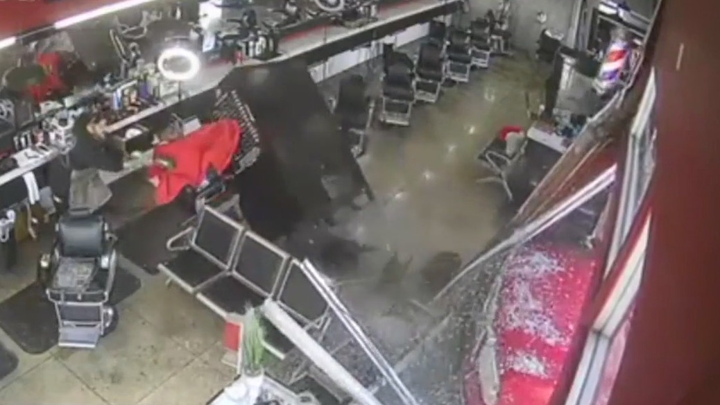 Truck smashes into barbershop