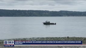 Crews use sonar scanner and drone in search of missing diver