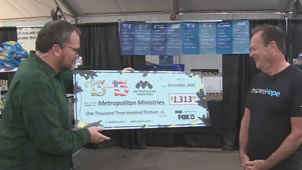 Charley presents $13 for 13 check to Metro Ministries