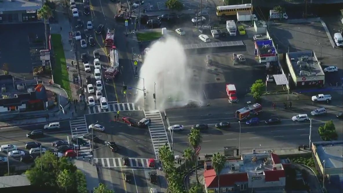 Massive water main break snarls traffic intersection