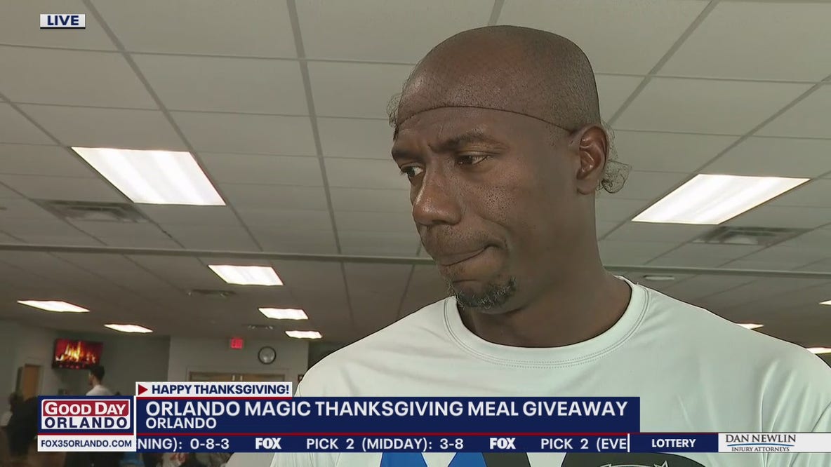 Orlando Magic's Bo Outlaw serving hot Thanksgiving meals to families in need