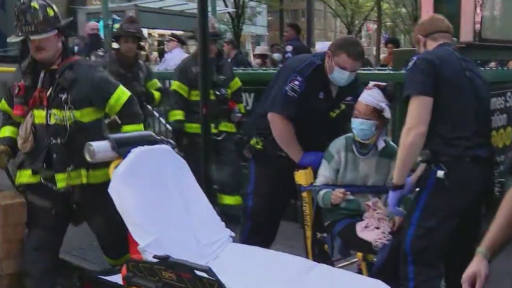Woman shoved onto subway tracks