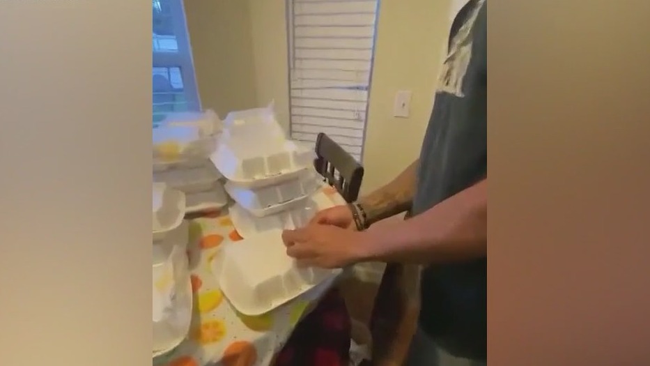 Football players feeding the less fortunate