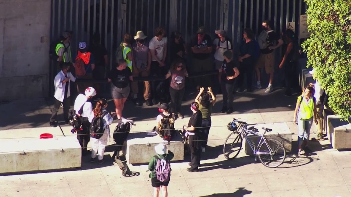 Protesters chain themselves together outside of SF federal building